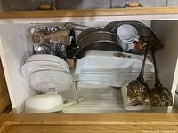 Drawer with assorted bakeware, utensils and amber goblets