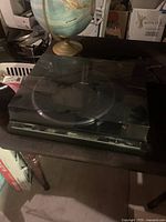Turntable with closed dust cover on table