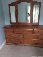 Front view showing dresser and tri-fold mirror