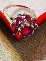 Angled view showing cluster of red stones and band