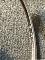 Close-up of interior wall showing 925 hallmark on sterling silver bangle
