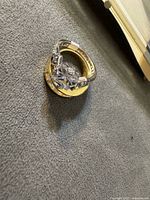 Two stacked rings showing central stone and band