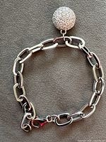 Full view of sterling silver chain bracelet with pavé sphere charm and lobster clasp
