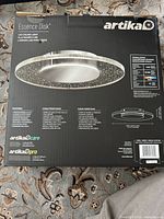 Retail box showing Artika Essence Disk LED ceiling light and specifications