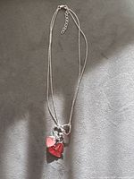 Full necklace showing chain, extender, lobster clasp and heart pendant