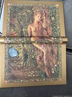 Front and back wraparound cover showing art-nouveau style female figure and ornamental border