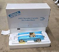 Model car in styrofoam insert with outer box visible