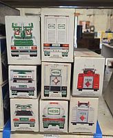 Stacked view of nine box backs showing Hess logos and year text