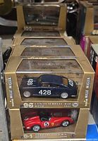 Four boxed Lancia Aurelia B20 models stacked
