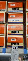Stack of four Lionel passenger car boxes with lot tag visible