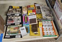 Group shot of all packaged train accessories on shelf