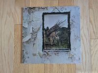 Front jacket with elderly man carrying sticks image