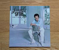 Front cover of Lionel Richie Can't Slow Down LP