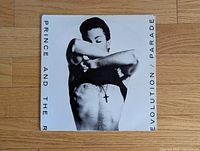 Front cover of Parade LP showing Prince torso with cross necklace