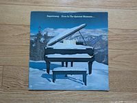 Front cover showing piano-in-snow artwork