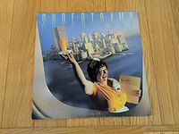 Front jacket artwork showing waitress and cityscape