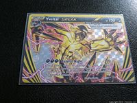 Front of Yveltal BREAK foil card in sleeve