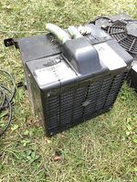 Front view showing grille and overall housing