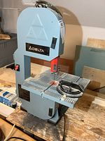 Front view of Delta benchtop band saw on workbench