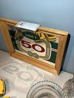Front view of Labatt's 50 Ale mirrored sign in wood frame