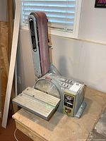 Full view of combination belt and disc sander on workbench