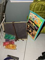 Front view showing Lite-Brite box, peg bags, design pack