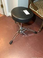 Full view of stool showing seat and base