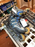 Pair of K2 inline skates on workbench, size tag visible