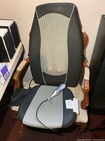Front view of entire Homedics massage seat cushion on chair