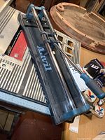 Full view of Anvil tile cutter on workbench