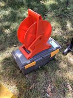Toolbox with cord reel on grass