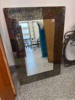 Front view of rectangular full-length mirror with iridescent glass mosaic tile frame