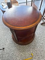 Top view showing circular veneered surface and inlaid border