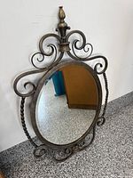 Front view showing entire ornate mirror and finish