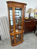 Full front view of Pulaski corner curio cabinet