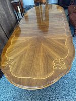 Top view showing wood grain, inlay detail, split for leaves