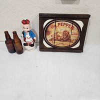 Group shot of Dr Pepper sign, MacBoozer decanter, two brown bottles