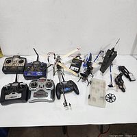 Overall lot with transmitters, helicopter frames, chargers and parts