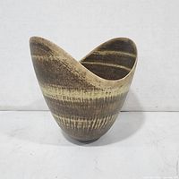 Front view of asymmetrical stoneware bowl showing glaze pattern