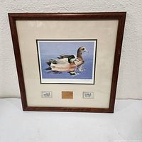 Full view of framed print with stamps and brass plate