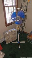 Pedestal fan and box fan together