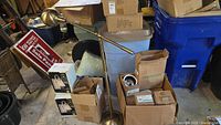 Overall lot showing brass floor lamp, boxed Lightolier recessed lights, other boxes