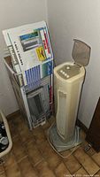 Window fan box and tower oscillating fan side by side