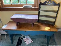 Group shot of wall shelf, riser, and bench showing overall style and finishes