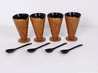 Four ceramic waffle cone cups and four spoons front view