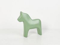 Front angled view of green ceramic Dala horse
