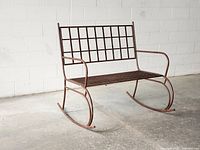 Front angled view of metal rocking bench