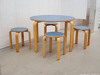 Overall view of table and four stools