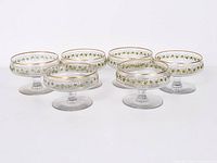 Six cordial stem glasses arranged in two rows