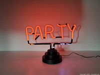 Lamp lit showing red glow of PARTY letters on base